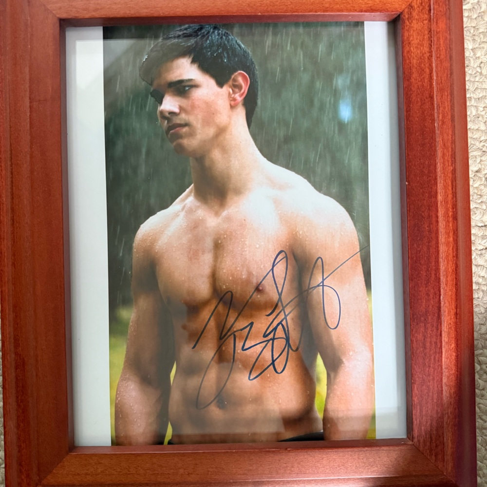 Signed Taylor Lautner photograph with certificate of authenticity.